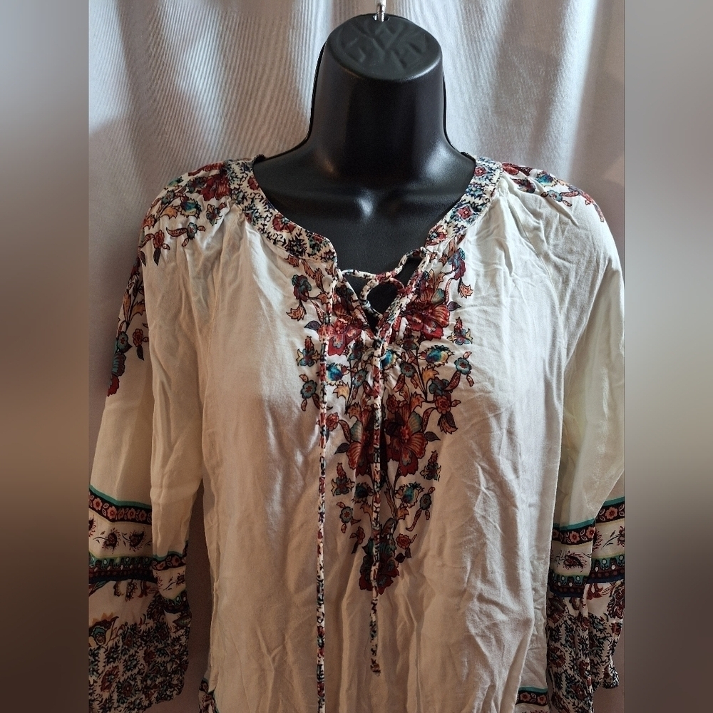 Valerie Steven's small slouchy floral blouse.